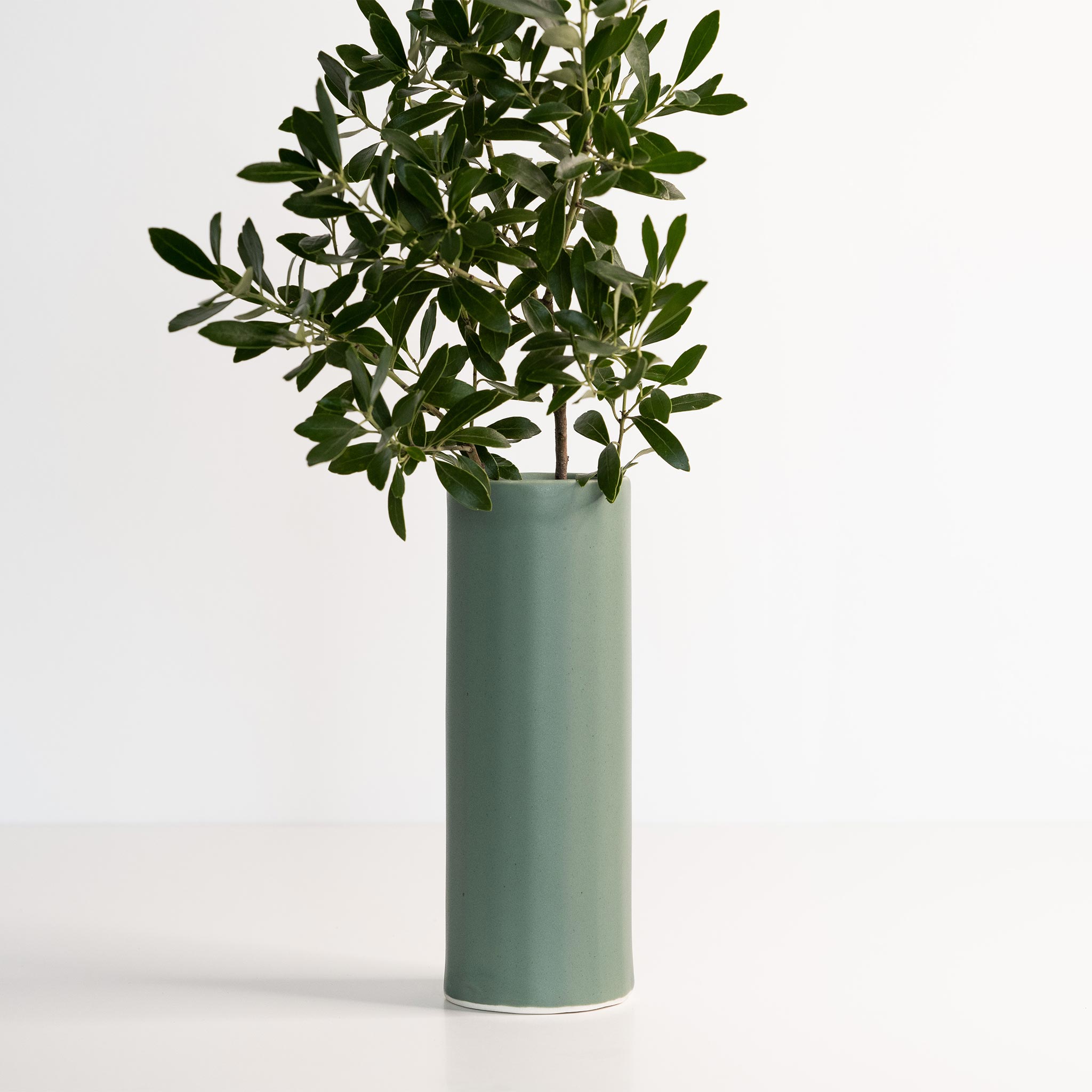 Handmade porcelain Bloom vase holding fresh flowers